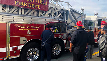 Members of the Manteca Fire Department show ABLE Consumers a fire engine.